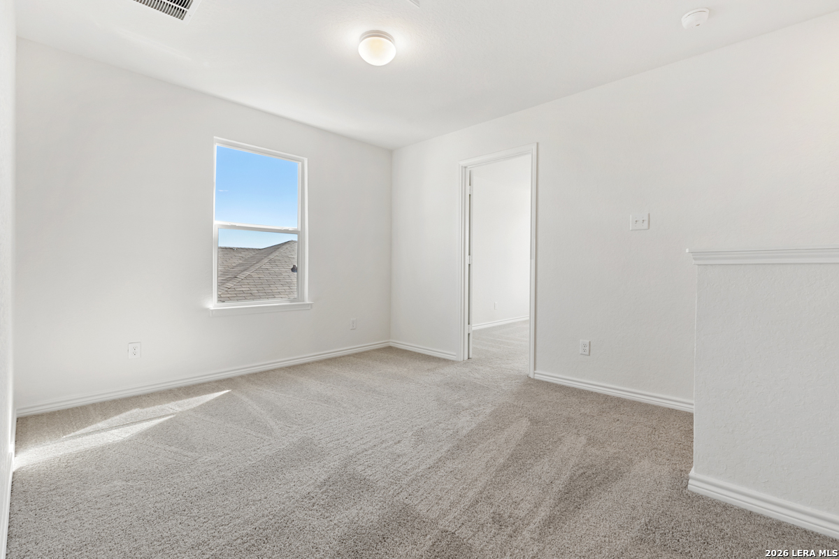 10030 Jagger Avenue Converse, TX 78109 - Photo 17 of 28 an empty room with windows