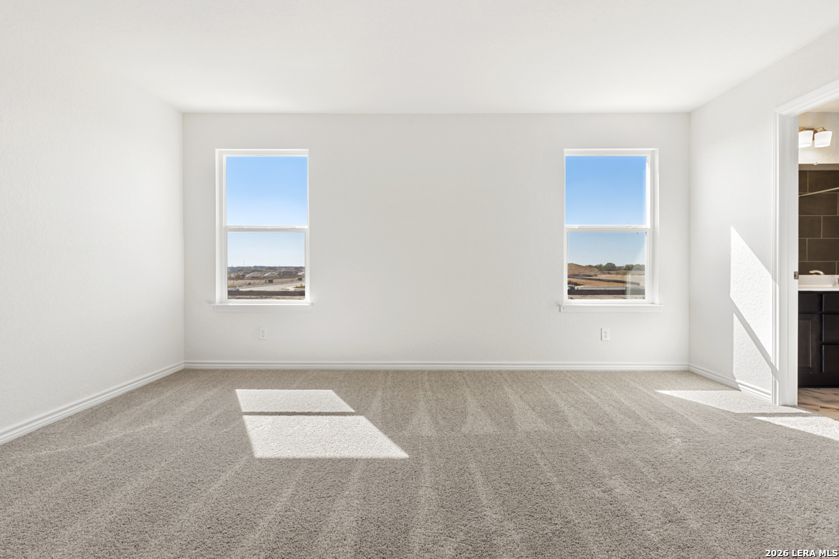 10030 Jagger Avenue Converse, TX 78109 - Photo 18 of 28 an empty room with windows