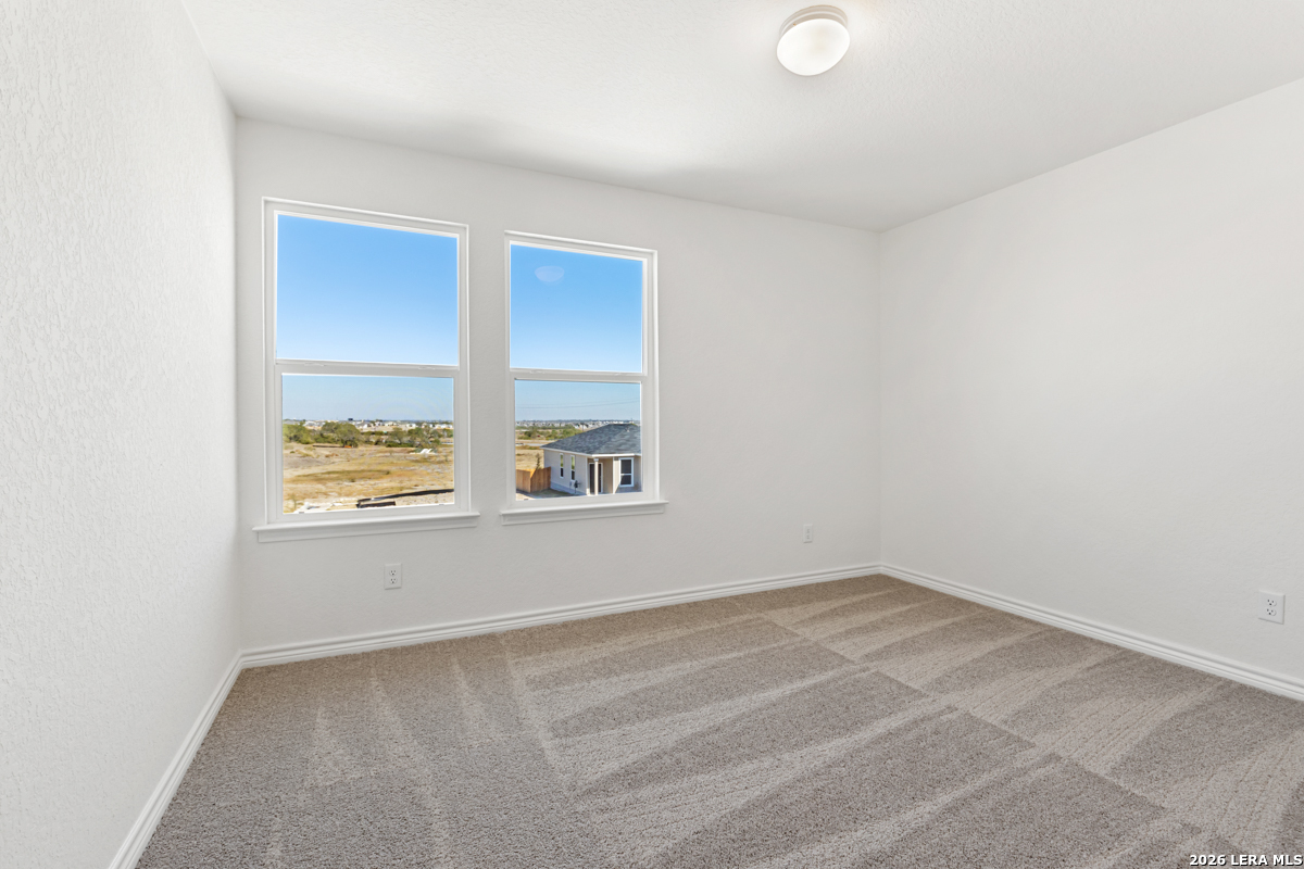 10030 Jagger Avenue Converse, TX 78109 - Photo 25 of 28 an empty room with windows