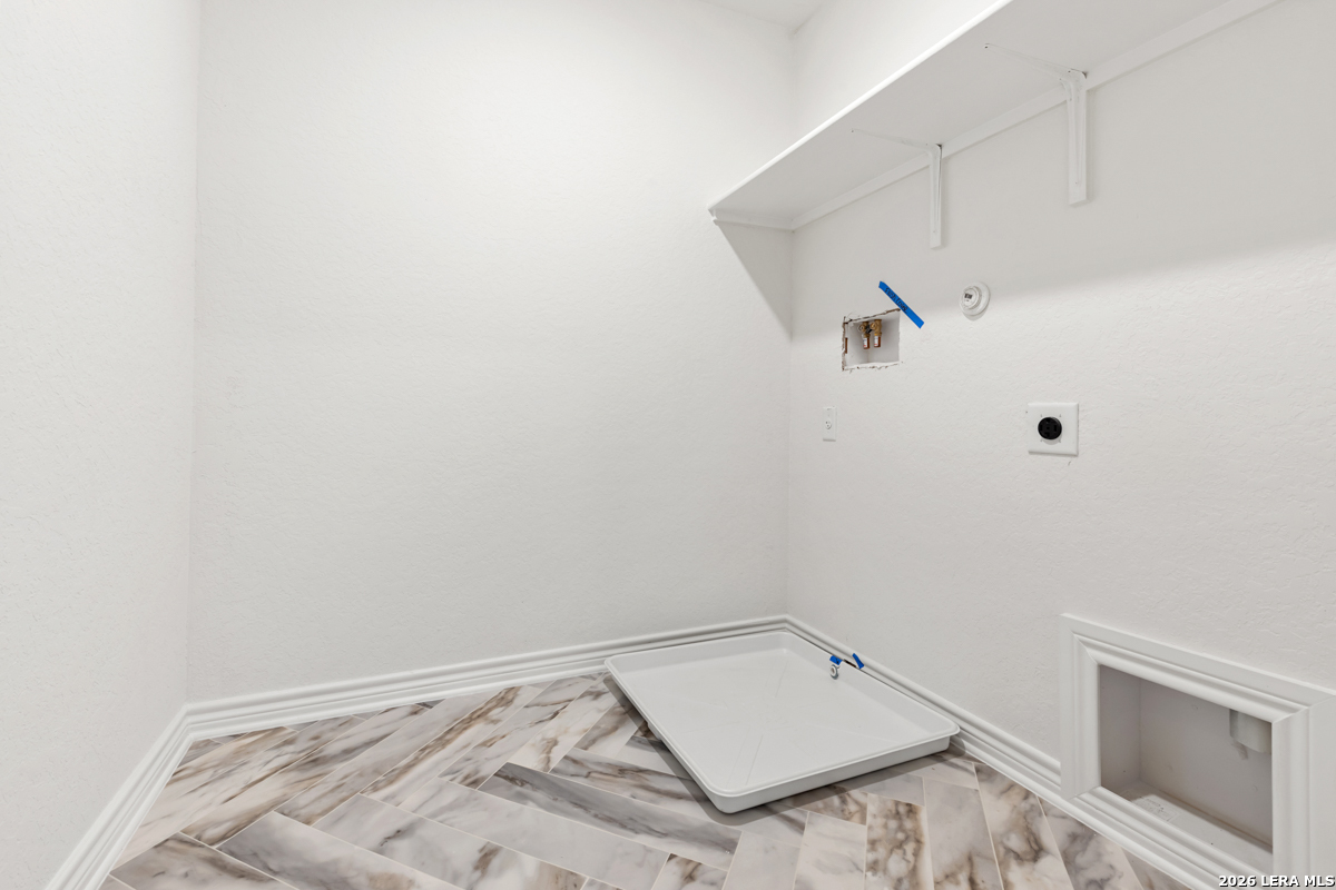 10030 Jagger Avenue Converse, TX 78109 - Photo 27 of 28 a view of a room with rack on the wall