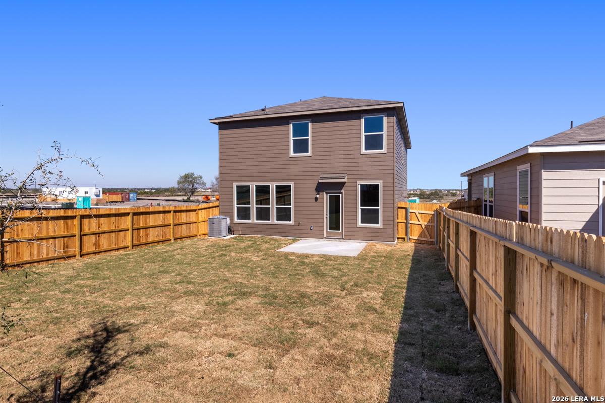 10030 Jagger Avenue Converse, TX 78109 - Photo 6 of 28 a view of a house with wooden floor next to a yard