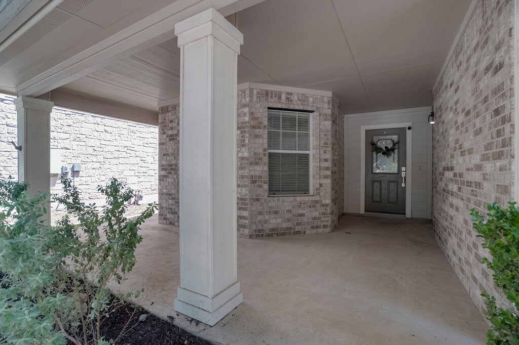 2724 Kickapoo Cavern Drive Pflugerville, TX 78660 - Photo 4 of 24 A welcoming covered porch with a durable concrete slab leads to the entry.
