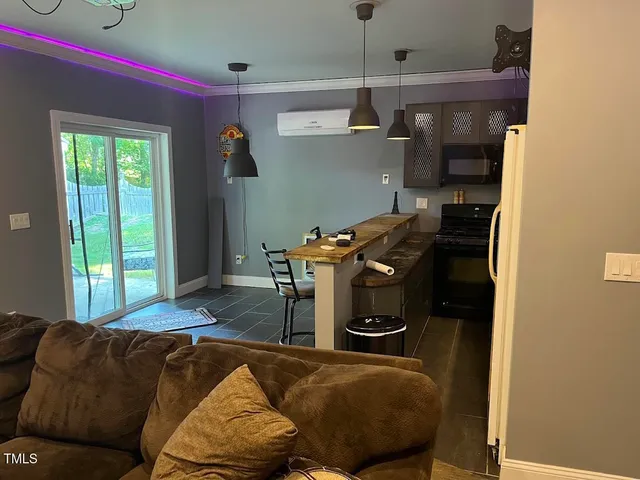 a living room with furniture and a window