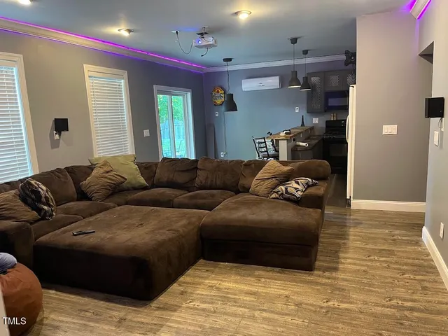 a living room with furniture and a window