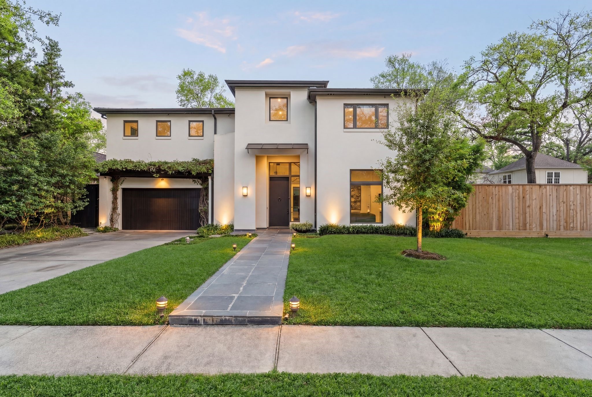 2409 Maconda Lane Houston, TX 77027 - Photo 1 of 40 a front view of a house with a yard and a garage
