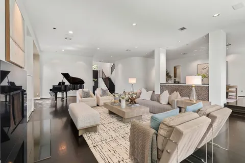 a dining room with furniture and wooden floor