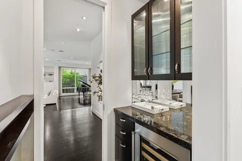 a kitchen with stainless steel appliances a sink stove and refrigerator