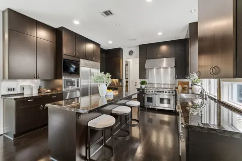 a kitchen with a stove and a sink