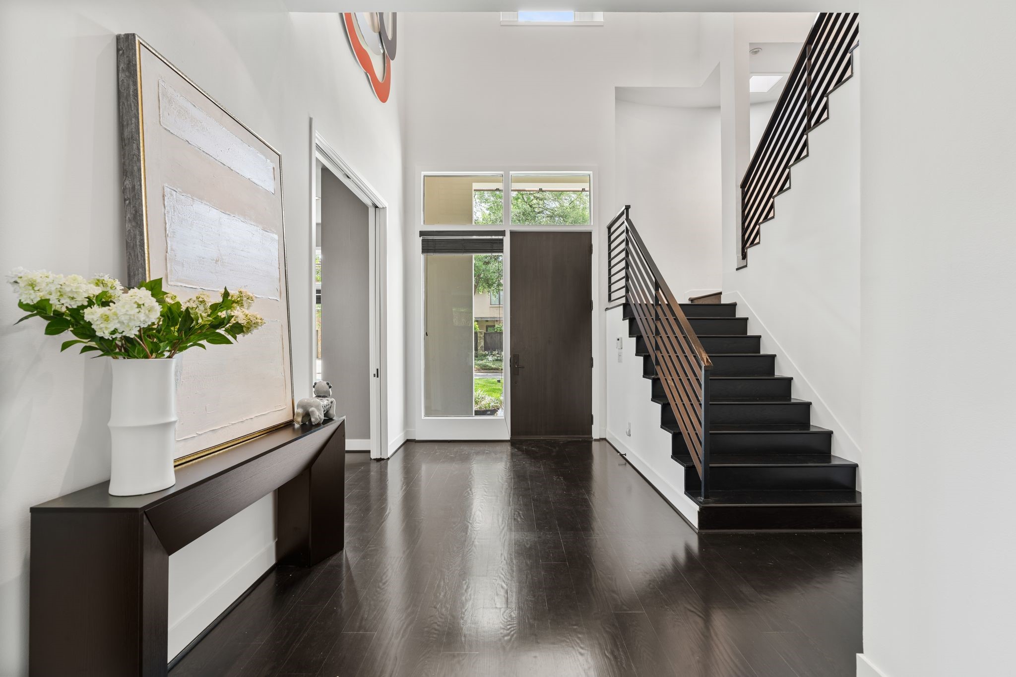 2409 Maconda Lane Houston, TX 77027 - Photo 2 of 40 a view of entryway and hall with wooden floor