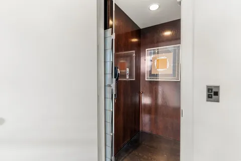 a bed room with a bed and a large window