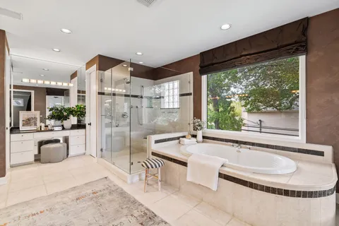 a large spacious bathroom with a tub and sink