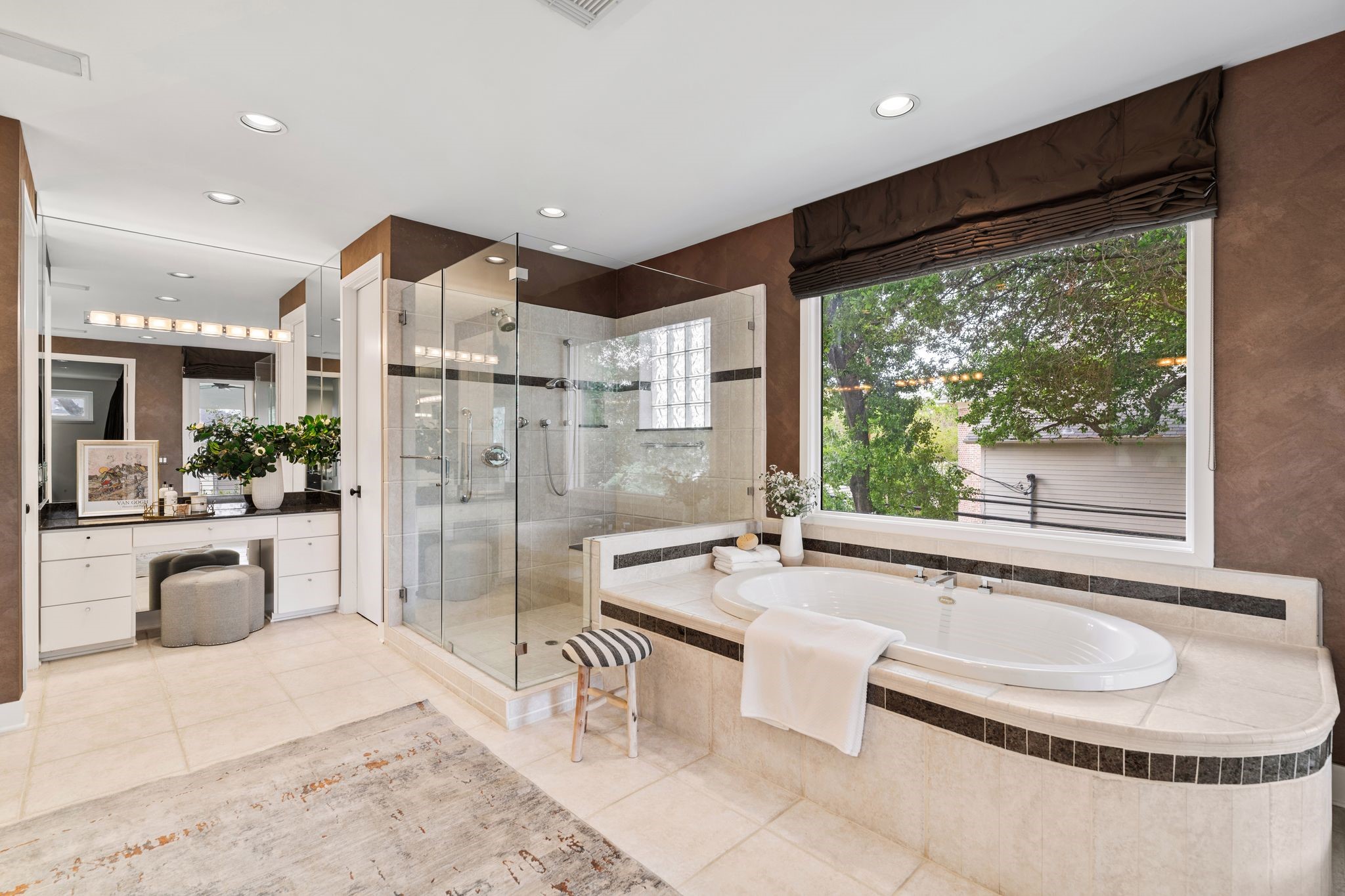2409 Maconda Lane Houston, TX 77027 - Photo 28 of 40 a large spacious bathroom with a tub and sink
