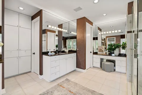 a kitchen with kitchen island a sink stove and refrigerator
