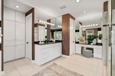 a kitchen with stainless steel appliances kitchen island granite countertop a refrigerator and a sink