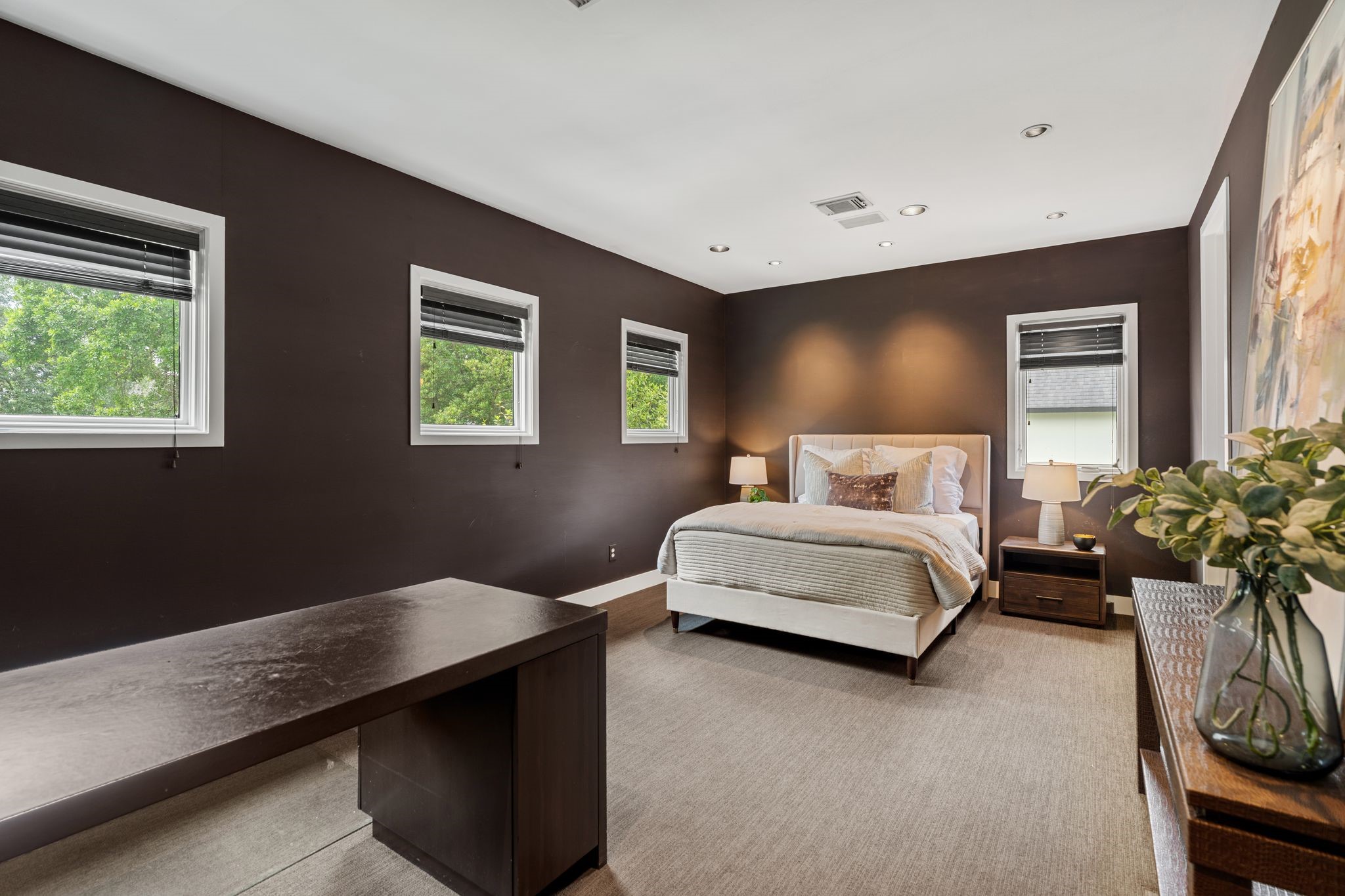 2409 Maconda Lane Houston, TX 77027 - Photo 31 of 40 a bedroom with a bed and potted plant
