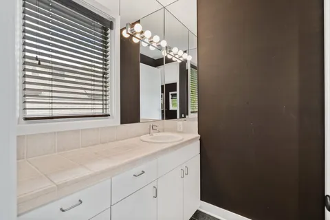 a bathroom with a sink and a mirror