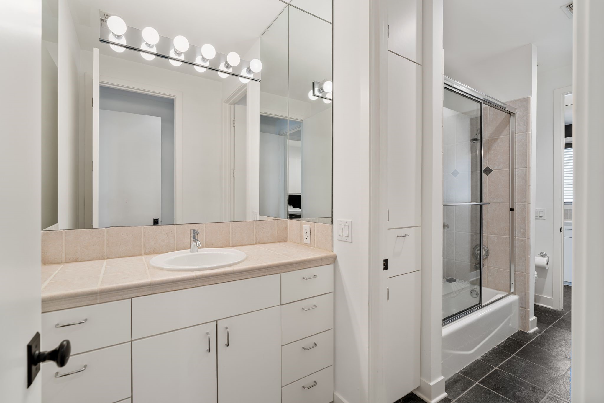 2409 Maconda Lane Houston, TX 77027 - Photo 34 of 40 a bathroom with a double vanity sink mirror and shower