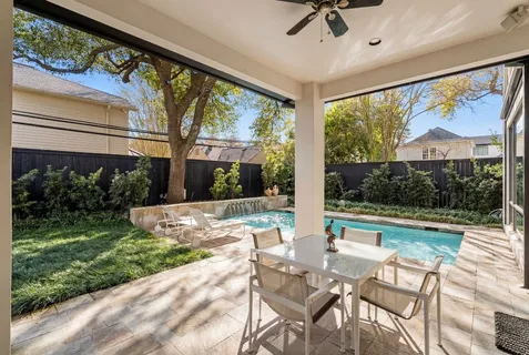 a front view of houses with yard