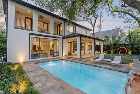 a view of a swimming pool with a bench
