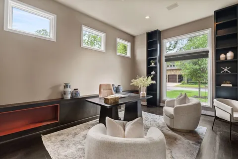 a kitchen with a table chairs stove and sink