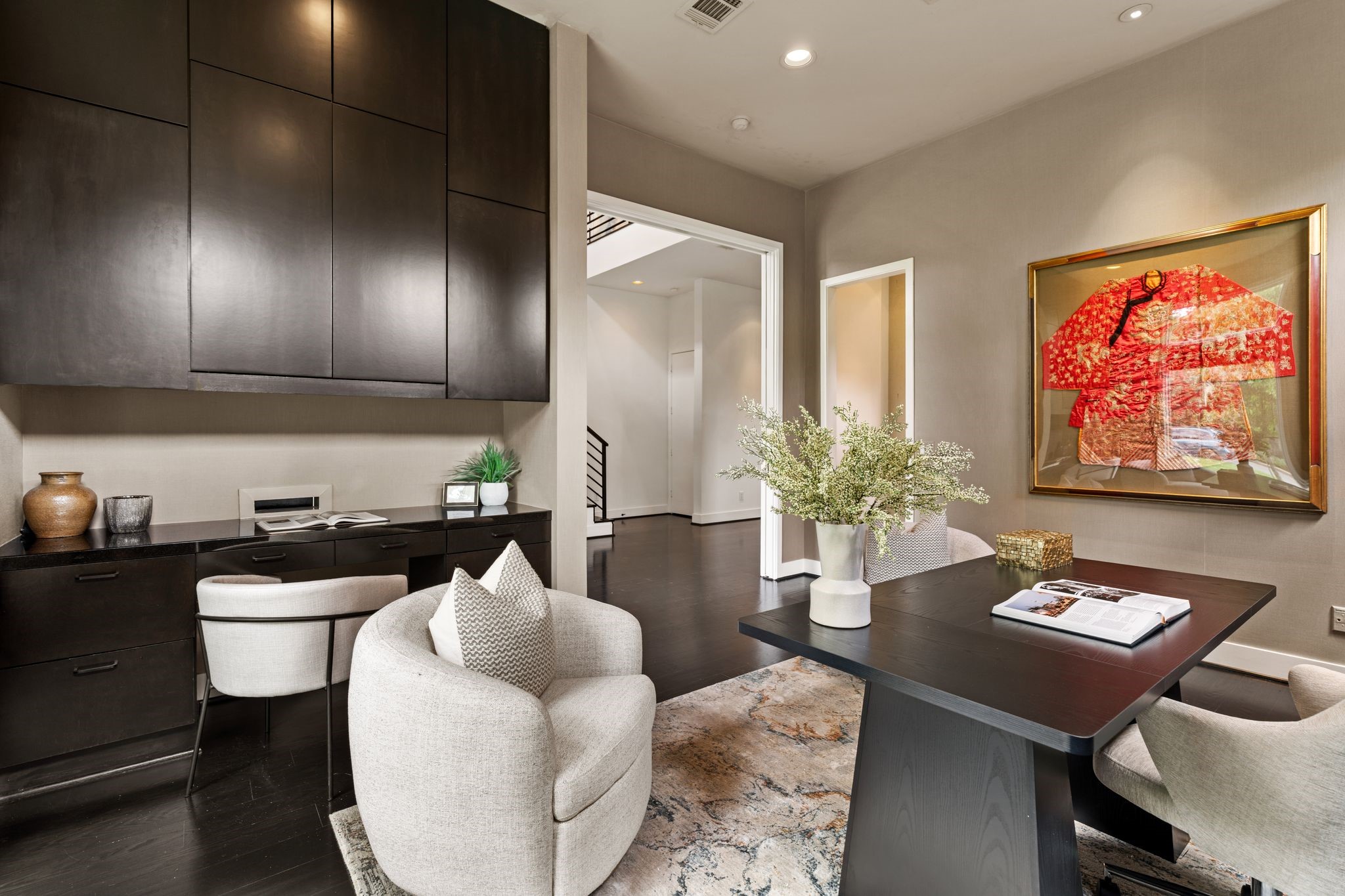 2409 Maconda Lane Houston, TX 77027 - Photo 6 of 40 a kitchen with a table chairs and a refrigerator