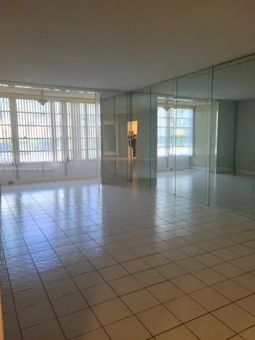 a view of an empty room and window