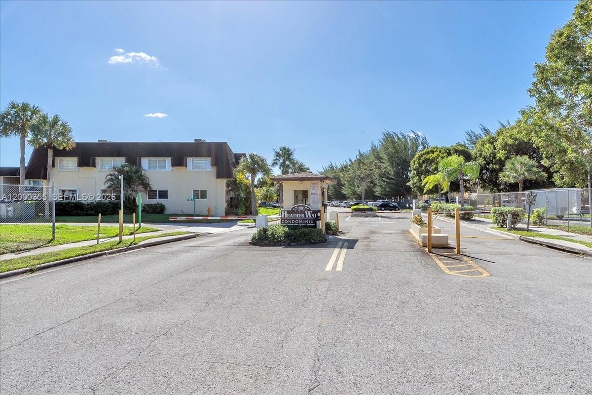 9009 Southwest 138th Street, Unit 202 Miami, FL 33176 - Photo 1 of 23 a view of a swimming pool with a patio and a yard