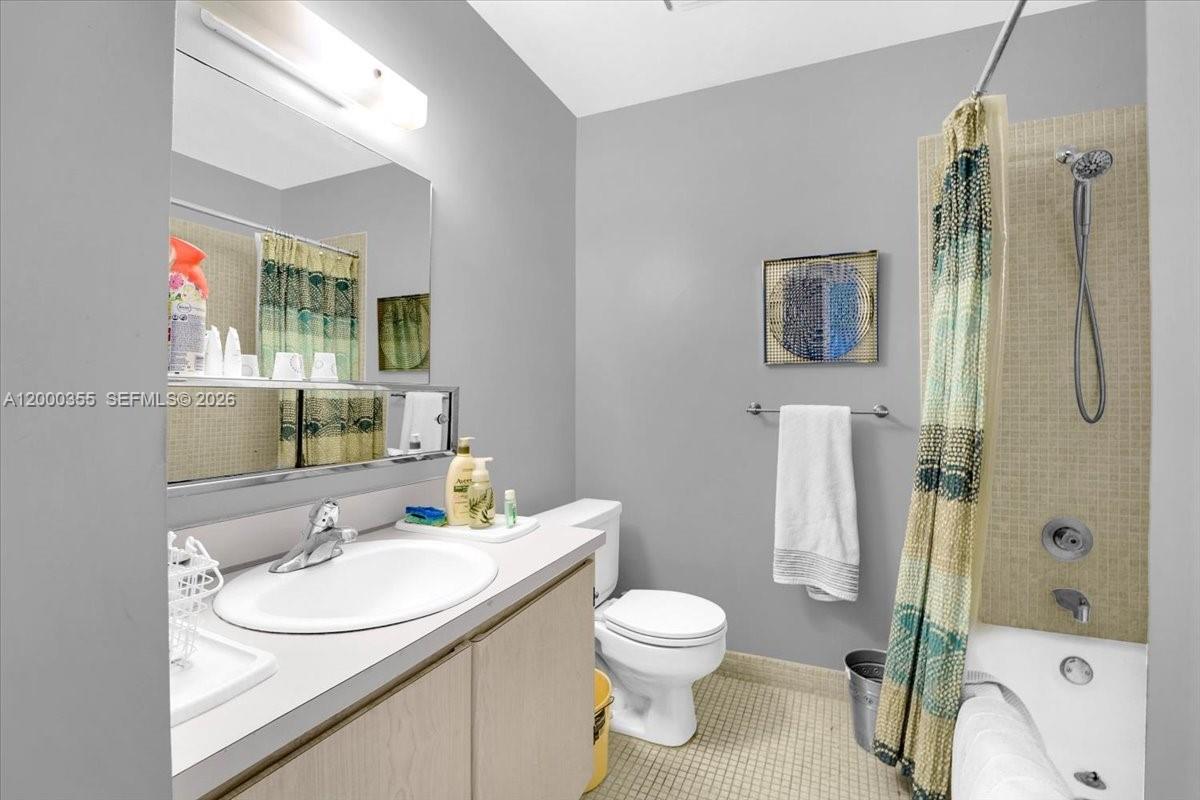 9009 Southwest 138th Street, Unit 202 Miami, FL 33176 - Photo 17 of 23 a bathroom with a sink toilet and shower