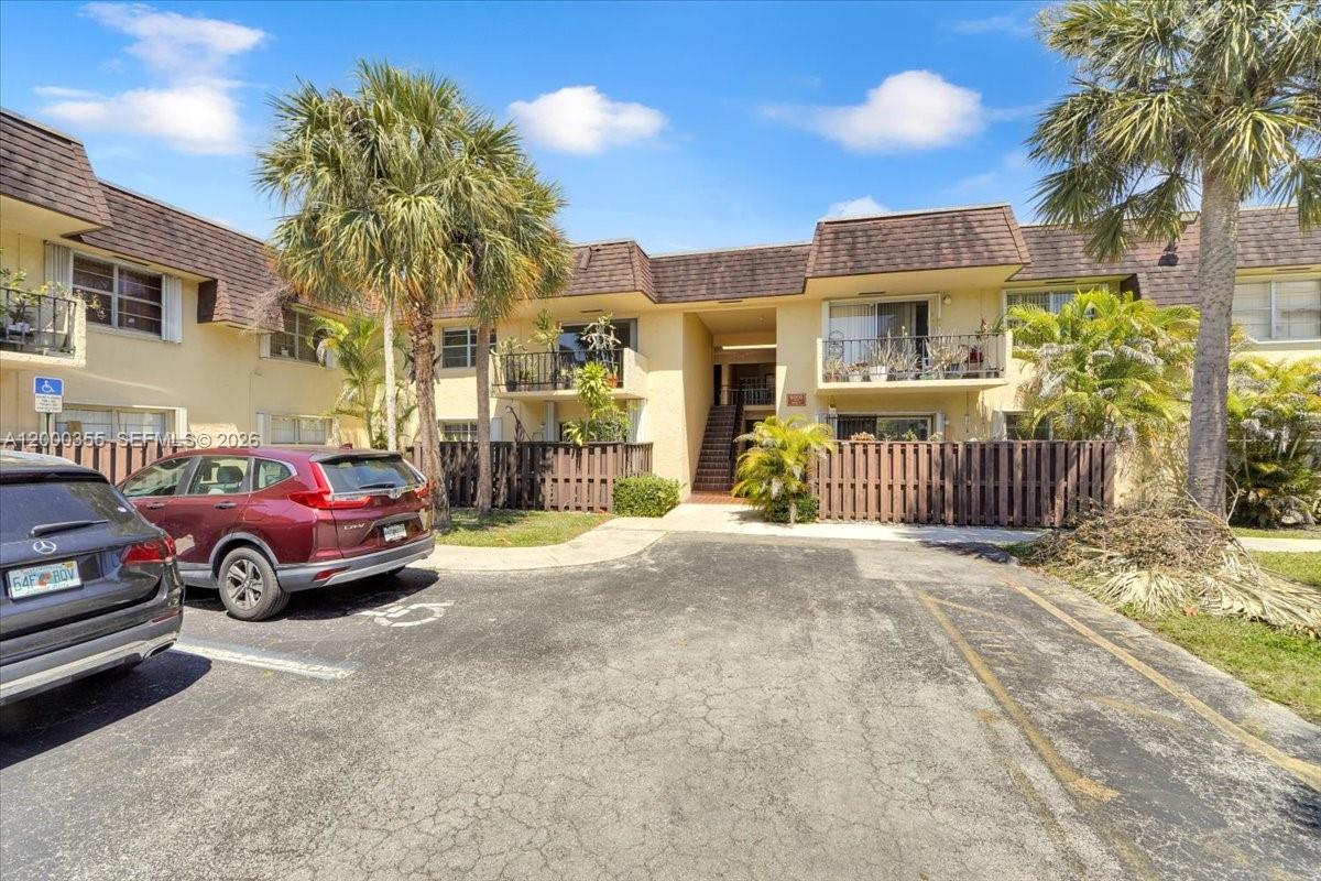9009 Southwest 138th Street, Unit 202 Miami, FL 33176 - Photo 2 of 23 a houses on the side of a street