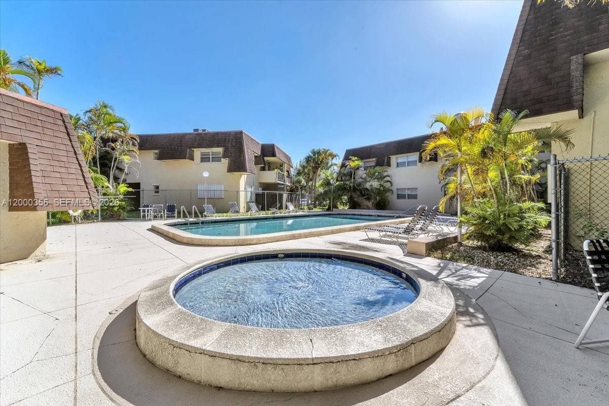 9009 Southwest 138th Street, Unit 202 Miami, FL 33176 - Photo 21 of 23 a view of swimming pool with outdoor seating
