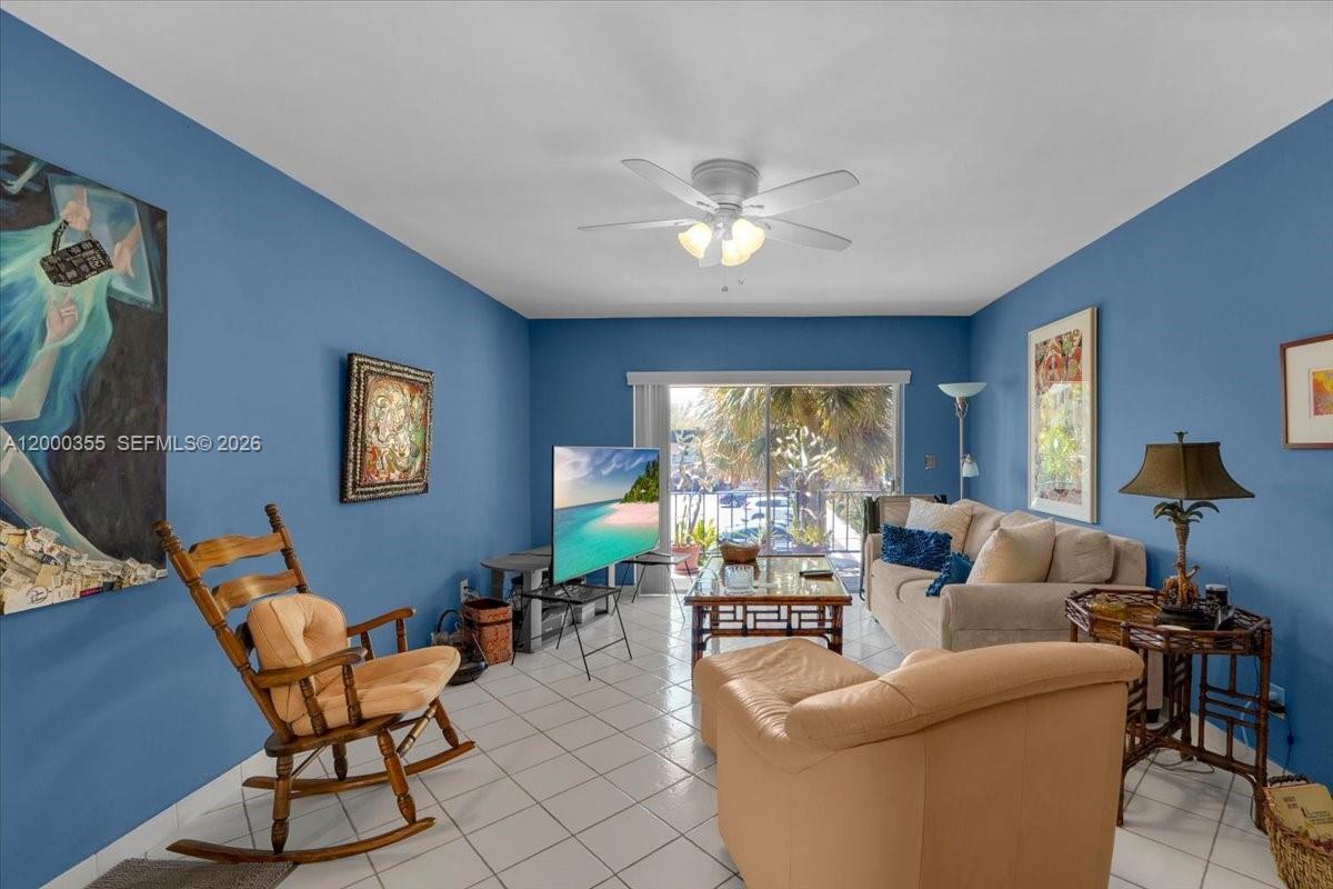 9009 Southwest 138th Street, Unit 202 Miami, FL 33176 - Photo 6 of 23 a living room with furniture and a large window