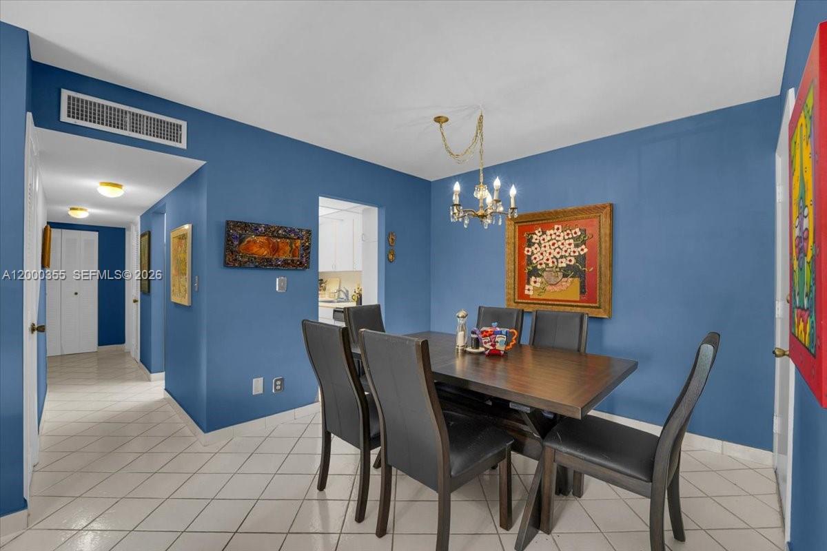 9009 Southwest 138th Street, Unit 202 Miami, FL 33176 - Photo 8 of 23 a view of a dining room with furniture