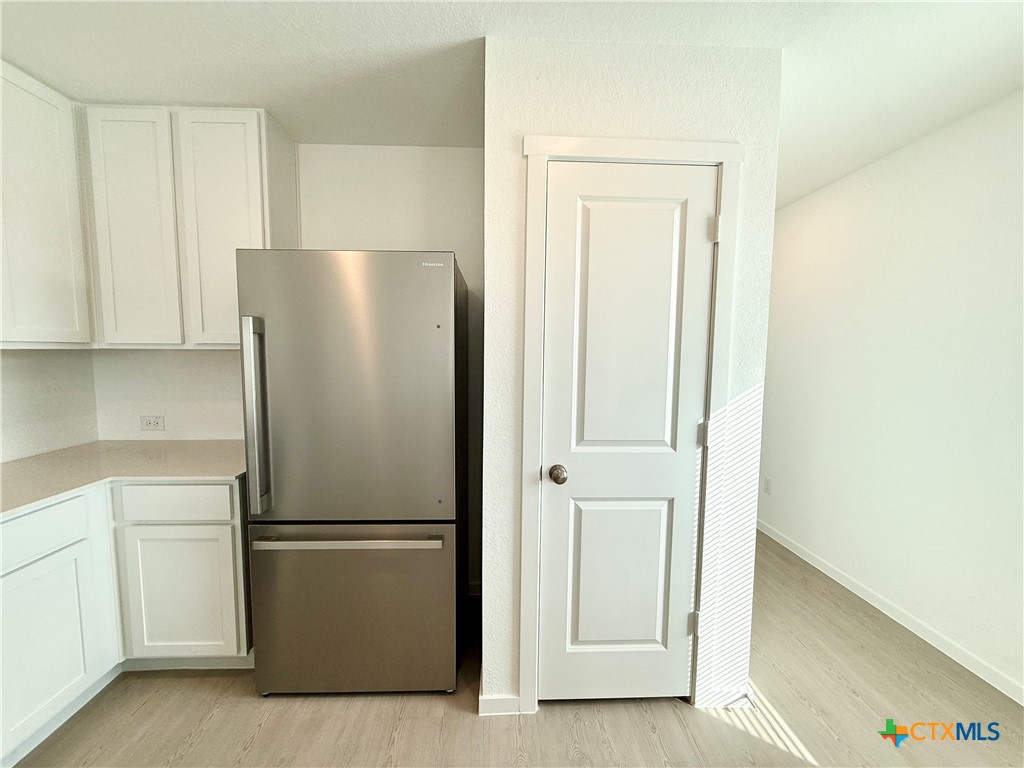 311 Moscato Road New Braunfels, TX 78130 - Photo 5 of 38 a white refrigerator freezer sitting in a kitchen