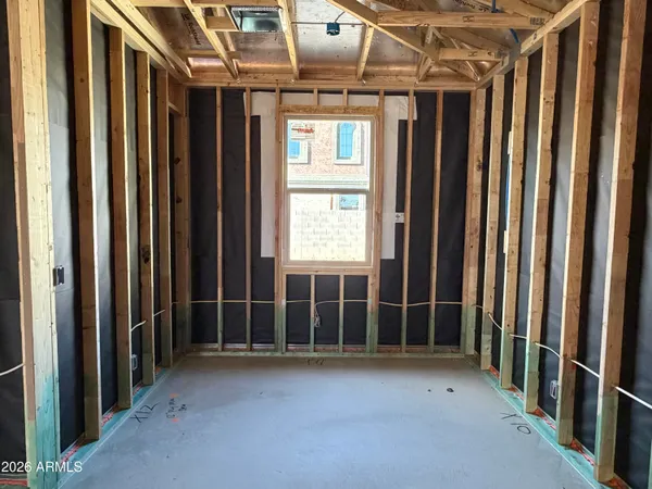 a view of a porch with wooden floor and windows