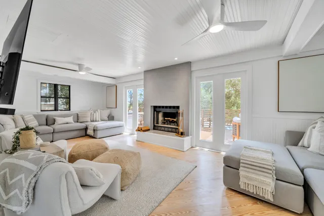 a living room with furniture fireplace and a flat screen tv