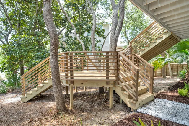 a view of a chair and table in the backyard