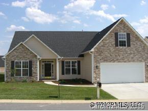69 Pamlico Road Fletcher, NC 28732 - Photo 1 of 8 a view of a yard in front of a house