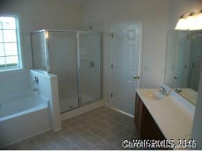 69 Pamlico Road Fletcher, NC 28732 - Photo 3 of 8 a bathroom with a shower a sink and a mirror