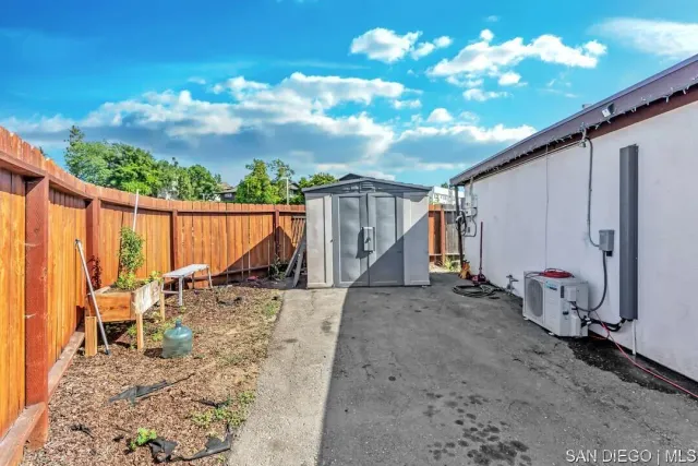 a view of a backyard with sitting area
