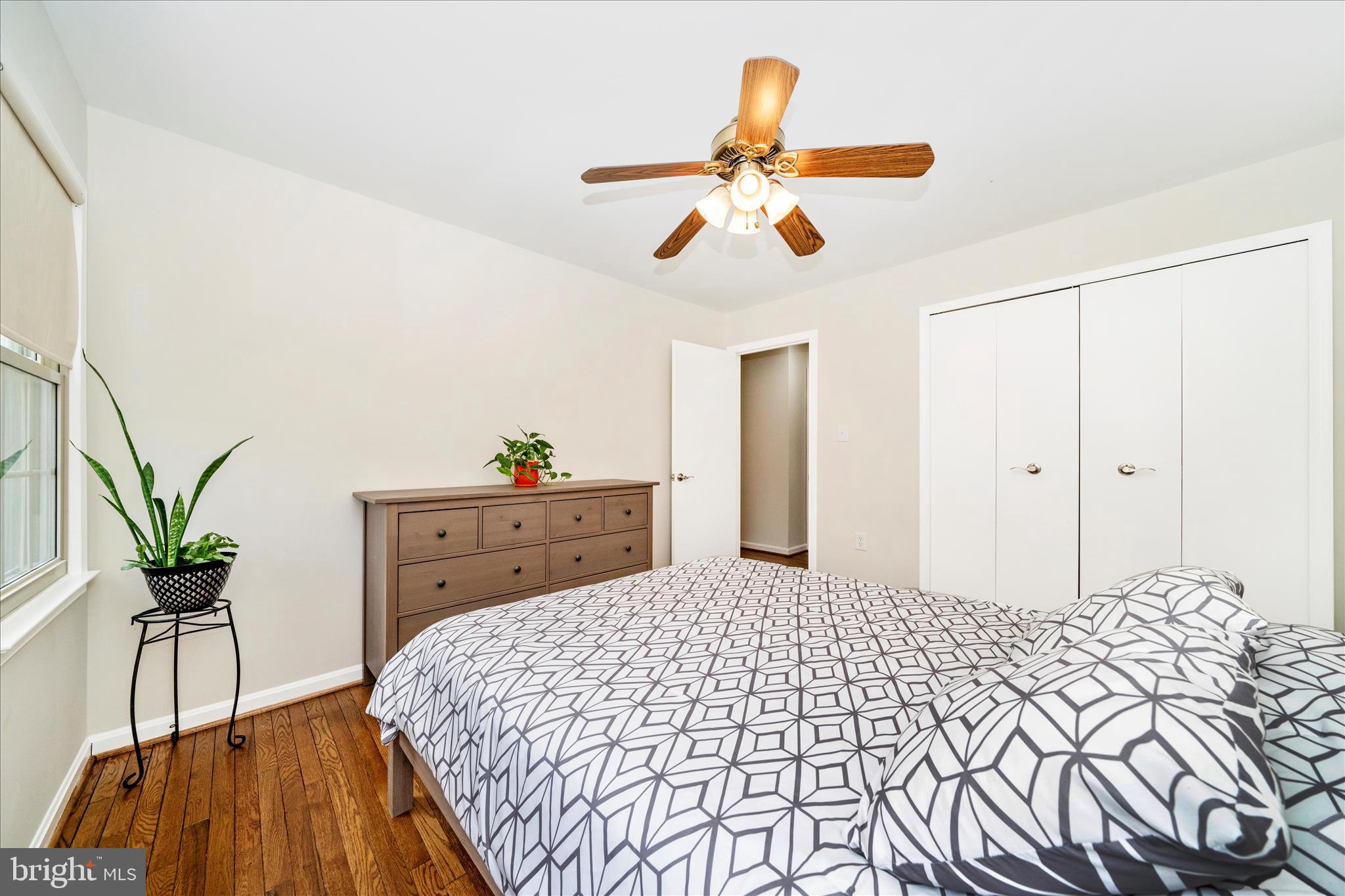 16000 Narrows Terrace Silver Spring, MD 20906 - Photo 31 of 54 a bedroom with a bed and a chandelier