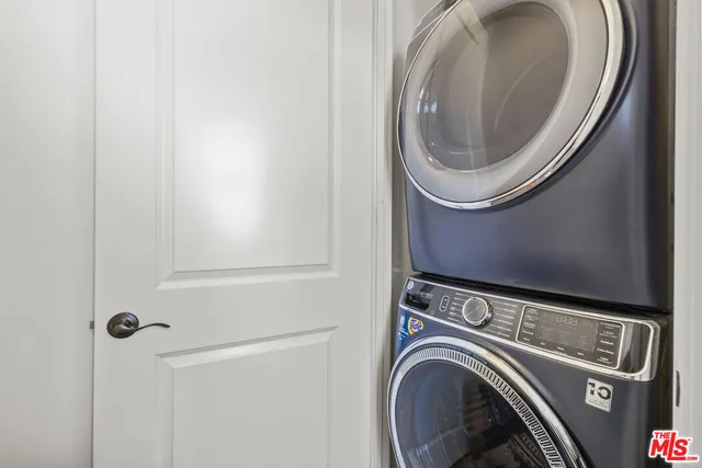 a view of a hallway to rooms and a window