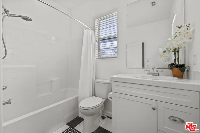 a patio with table and chairs