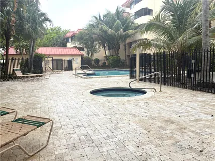 a swimming pool with outdoor seating and yard