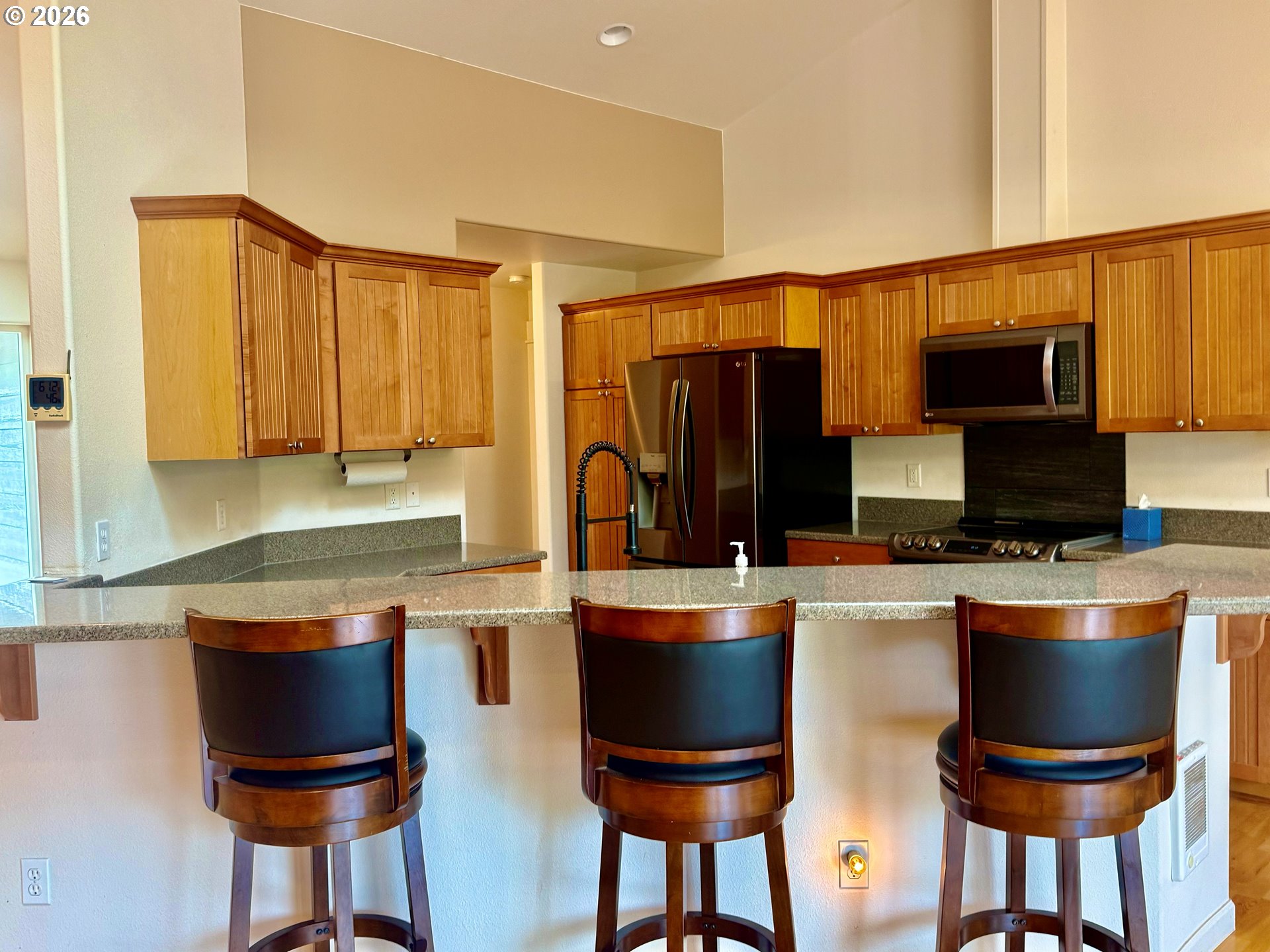 4797 Cloudcroft Lane Florence, OR 97439 - Photo 11 of 33 a kitchen with stainless steel appliances a stove a sink and a refrigerator
