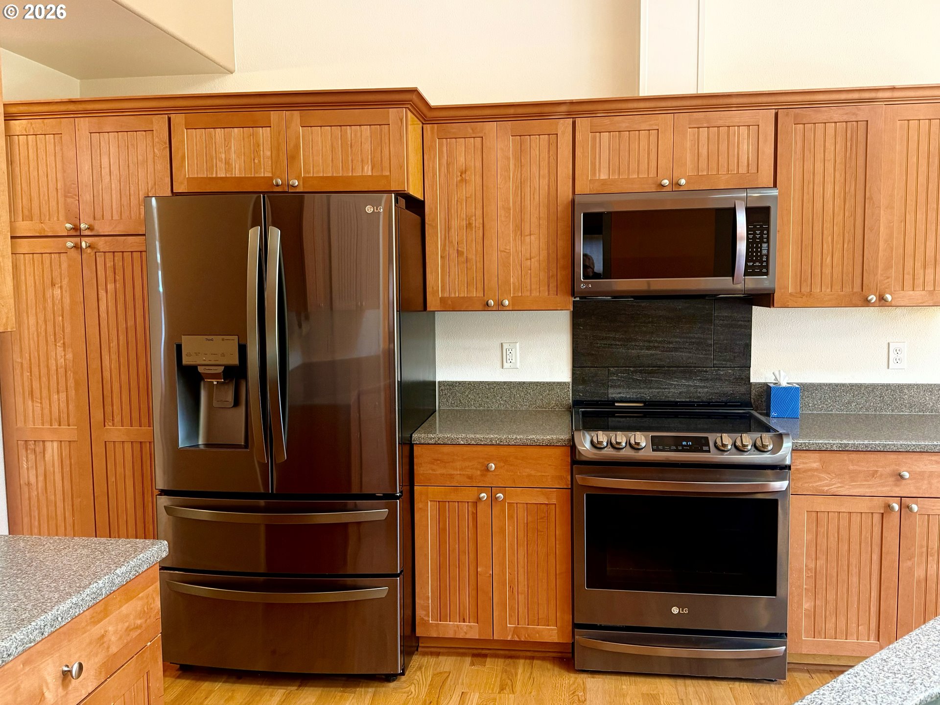 4797 Cloudcroft Lane Florence, OR 97439 - Photo 13 of 33 a kitchen with wooden cabinets and stainless steel appliances