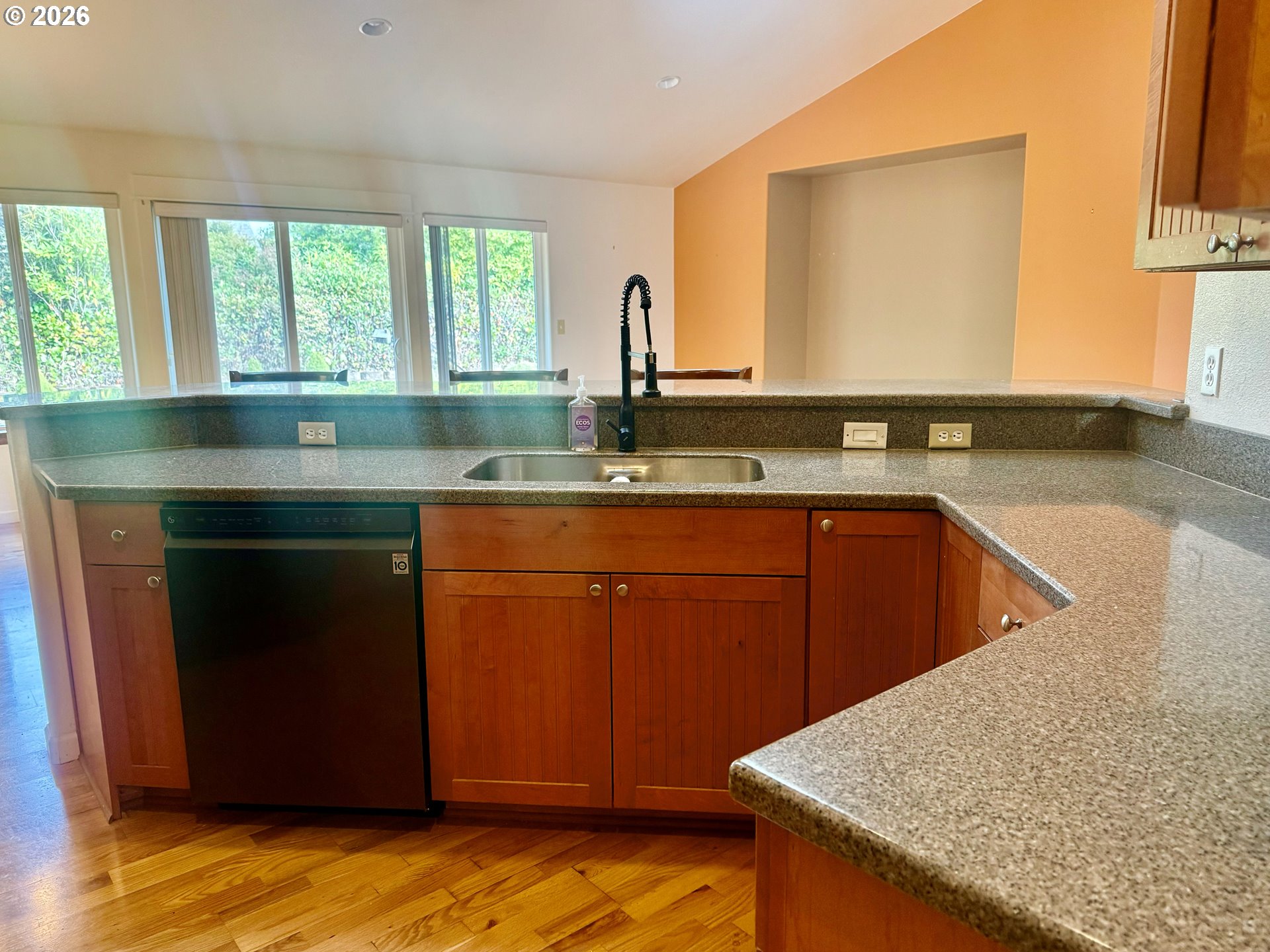 4797 Cloudcroft Lane Florence, OR 97439 - Photo 14 of 33 a kitchen with a sink cabinets and a wooden floor