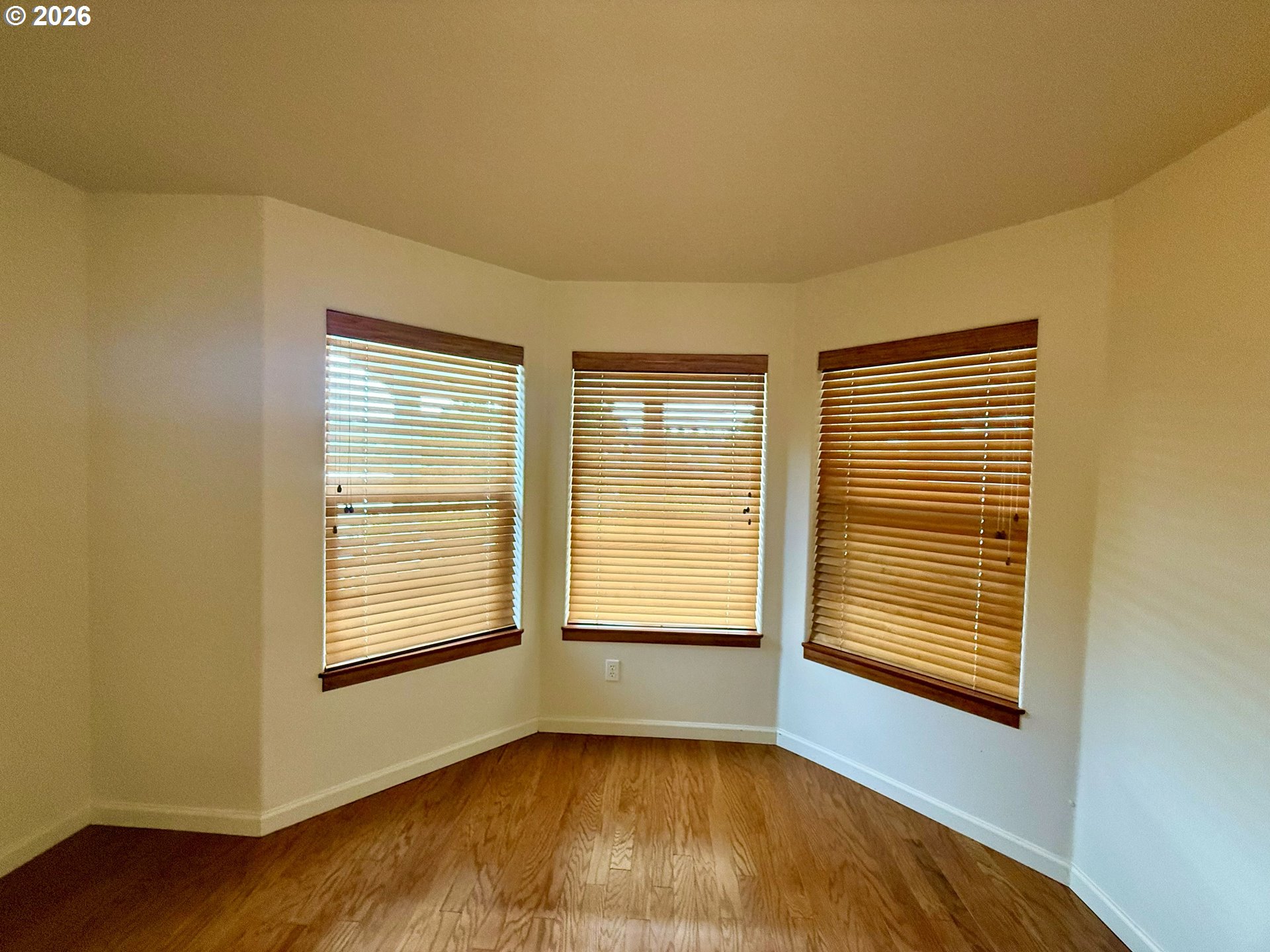 4797 Cloudcroft Lane Florence, OR 97439 - Photo 28 of 33 a view of an empty room with wooden floor and a window