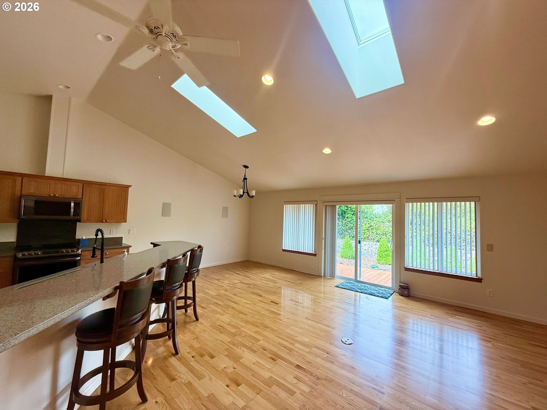 4797 Cloudcroft Lane Florence, OR 97439 - Photo 7 of 33 a view of a dining room with furniture window and wooden floor