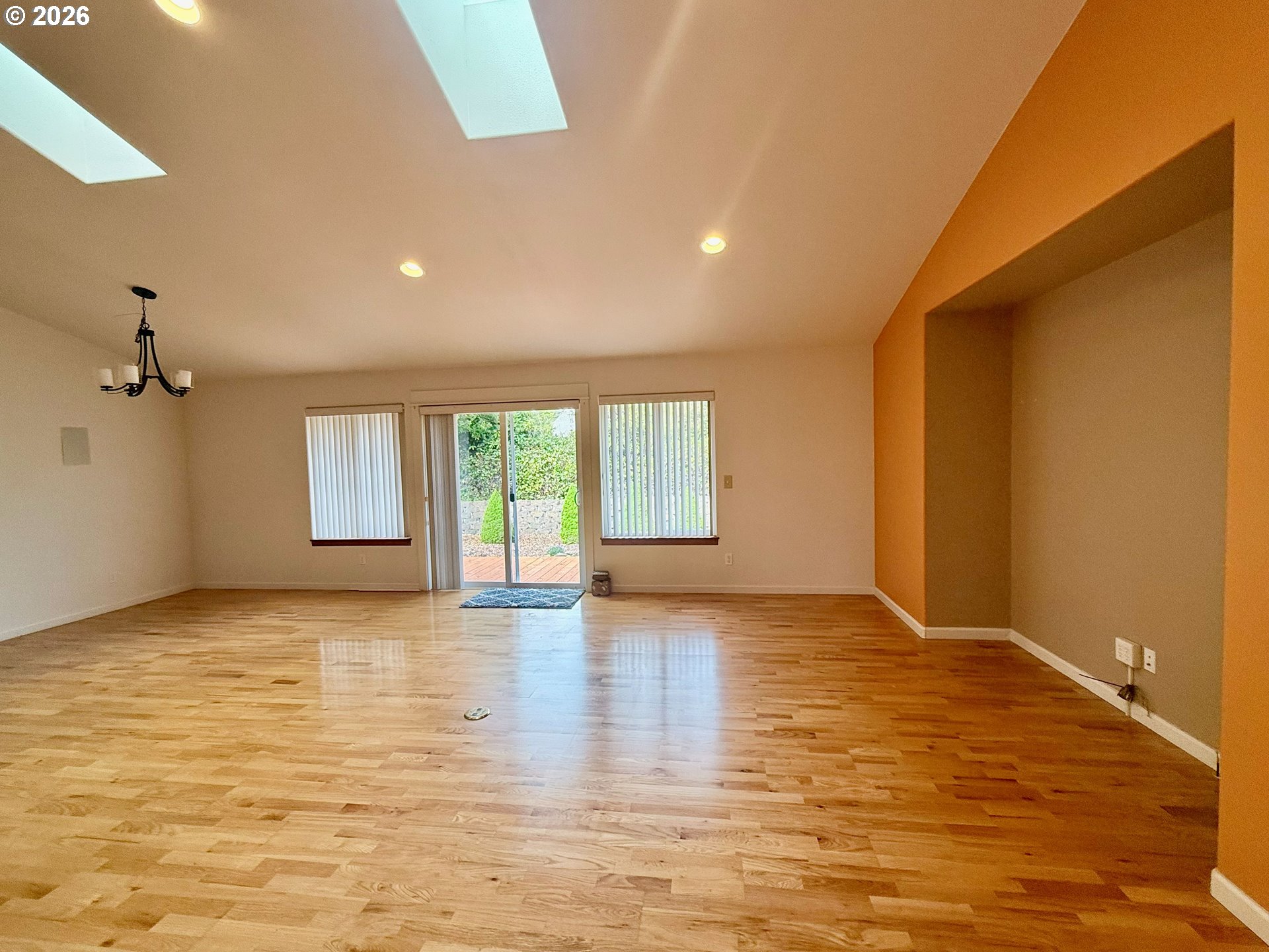 4797 Cloudcroft Lane Florence, OR 97439 - Photo 8 of 33 an empty room with wooden floor and windows