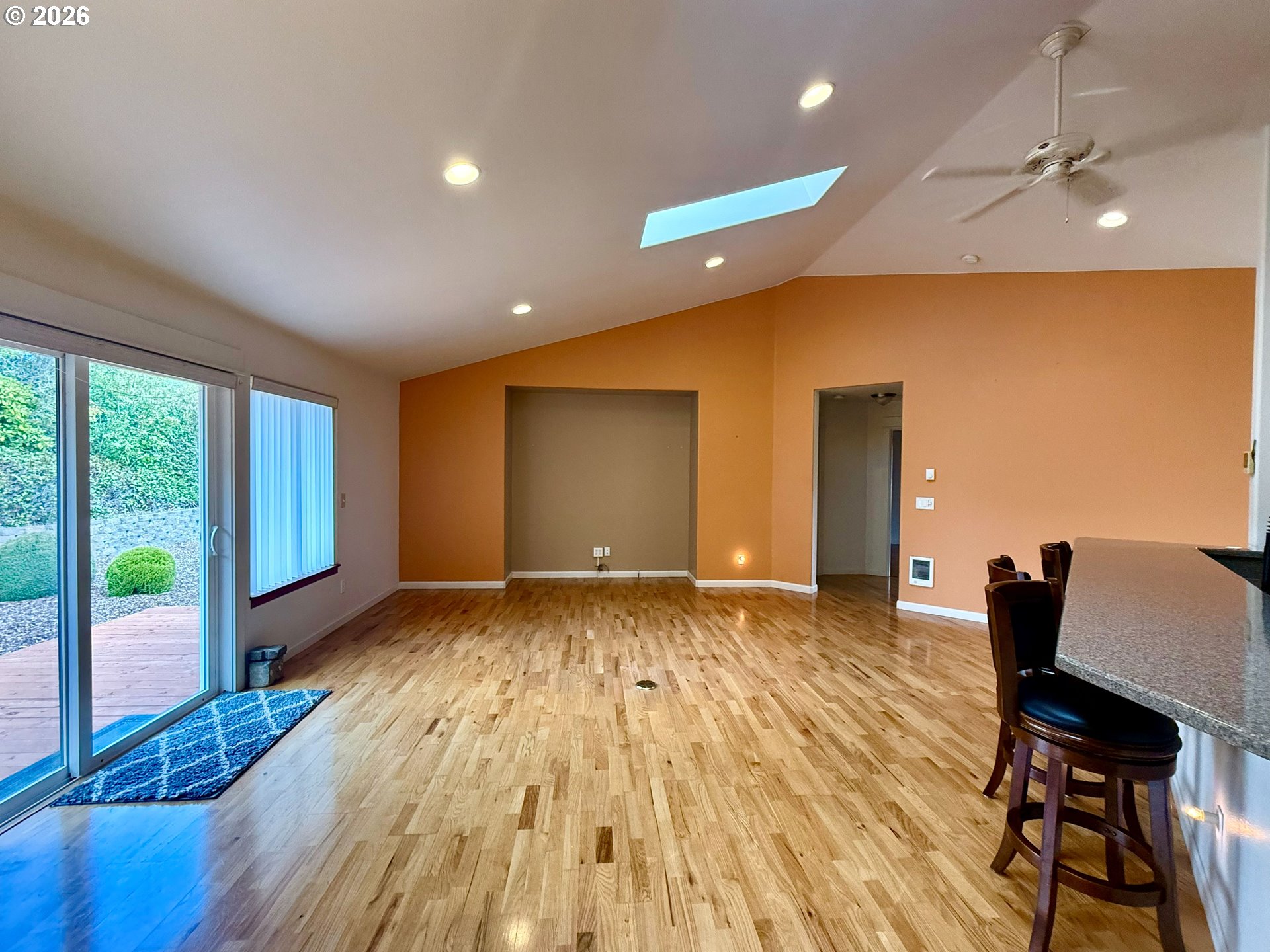 4797 Cloudcroft Lane Florence, OR 97439 - Photo 10 of 33 a view of an empty room with wooden floor and a window